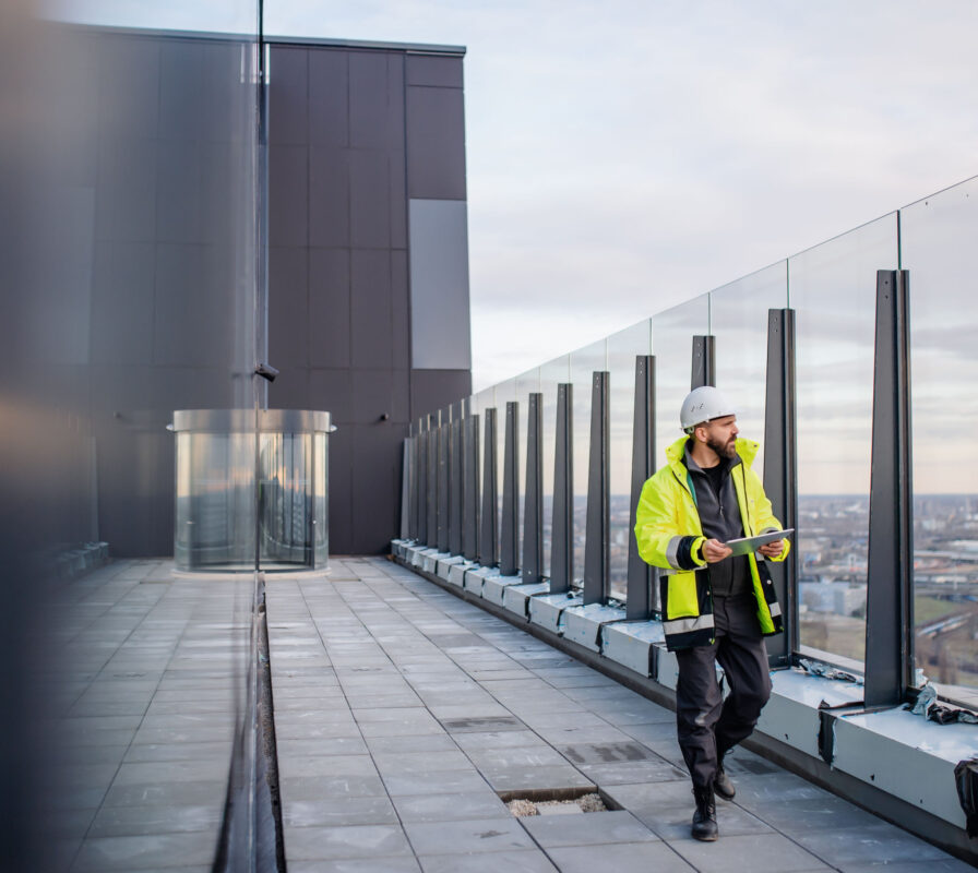 A builder assessing conditions of a building